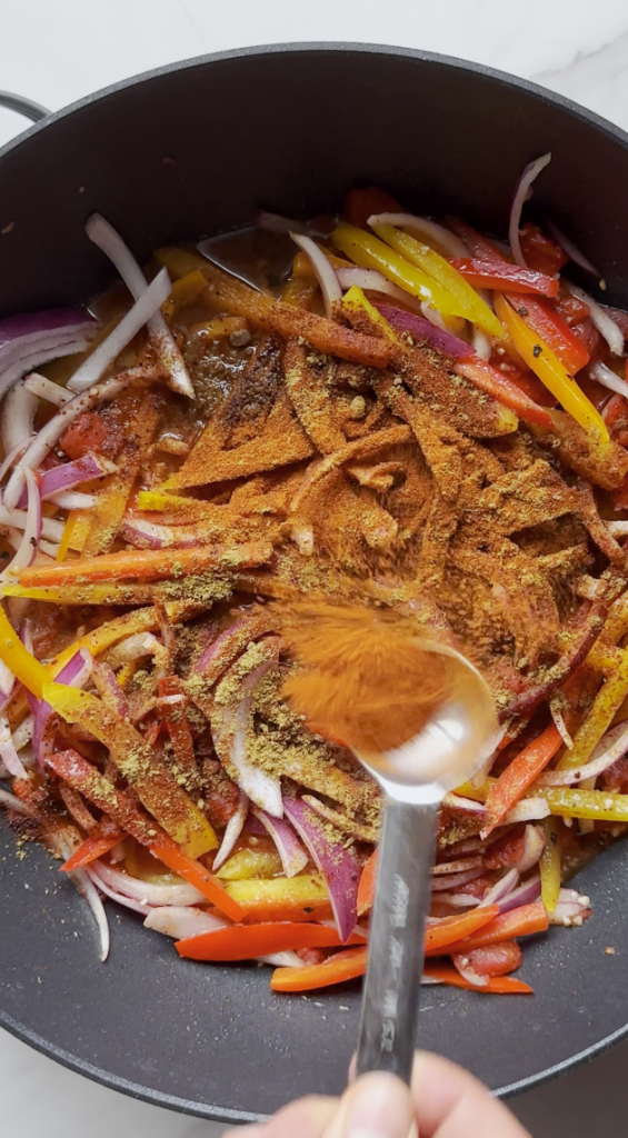 seasonings going into the chicken fajita pasta